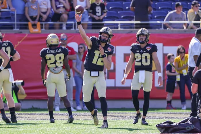 Purdue Boilermakers quarterback Austin Burton (12) warms up before the game against the Purdue Boilermakers at Camping World Stadium.